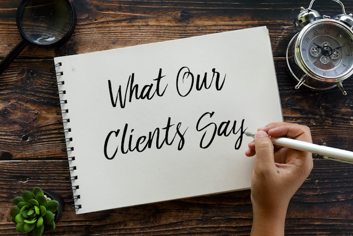 notepad that says 'what our clients say'