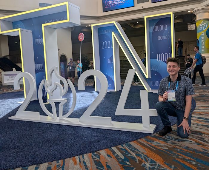 jared patten next to a sign for the it nation connect event